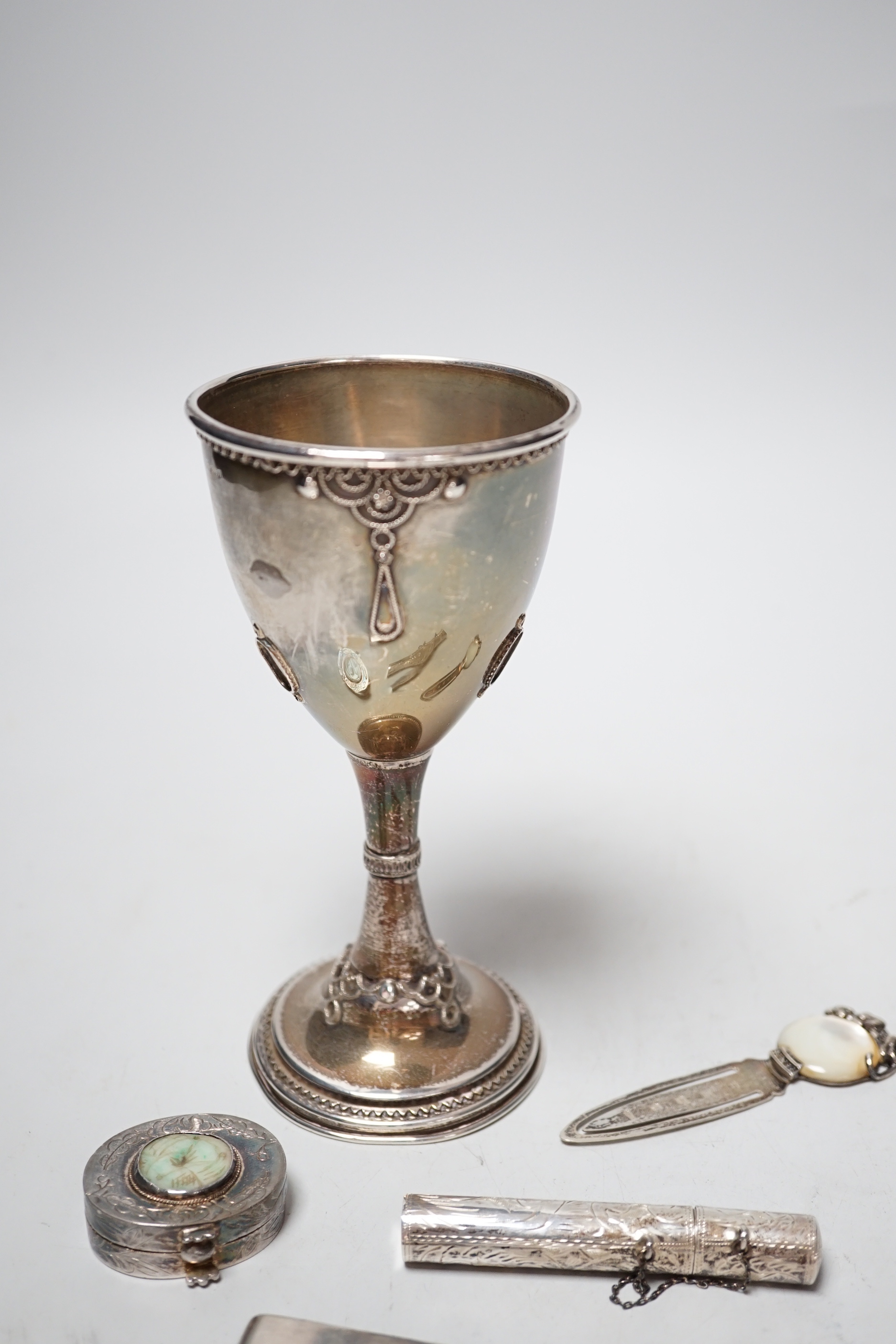 A 1960's silver and turquoise set goblet, import marks for London, 1966 (stones missing), 14.1cm and four small silver or white metal items including a bookmark and money clip.